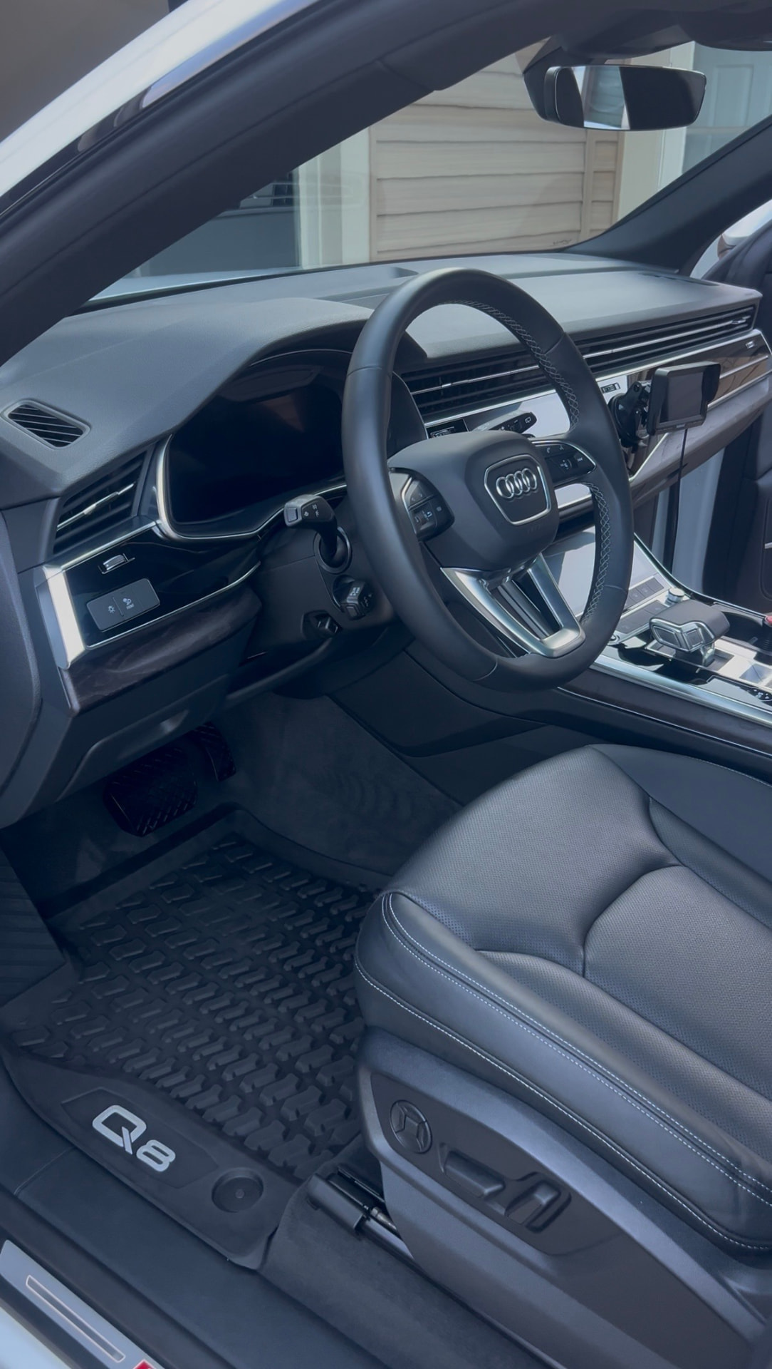 Deep cleaned black leather interior of an Audi Q8
