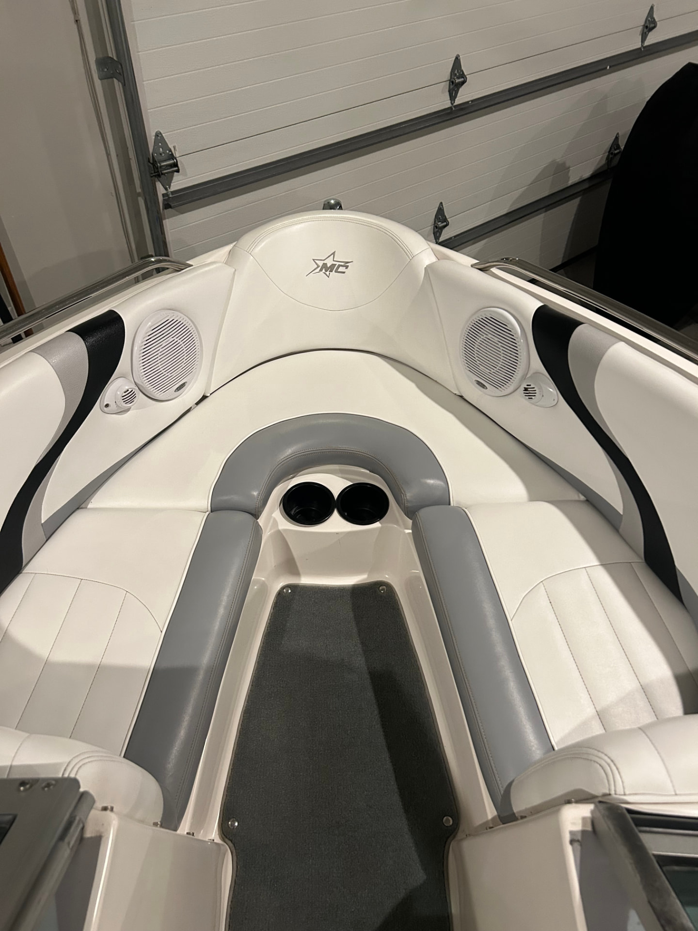 Deep cleaned MasterCraft boat interior with white and grey vinyl seating
