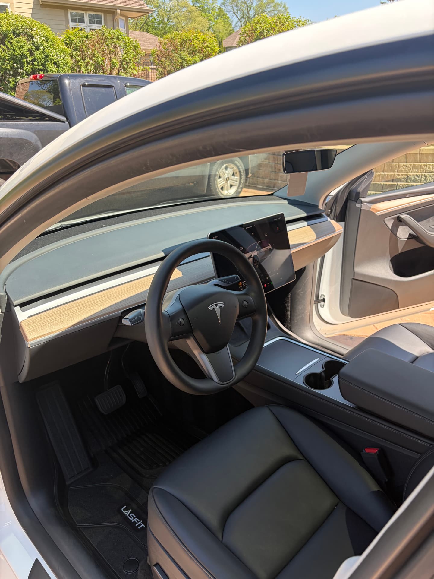 Deep cleaned black leather interior of a Tesla Model 3