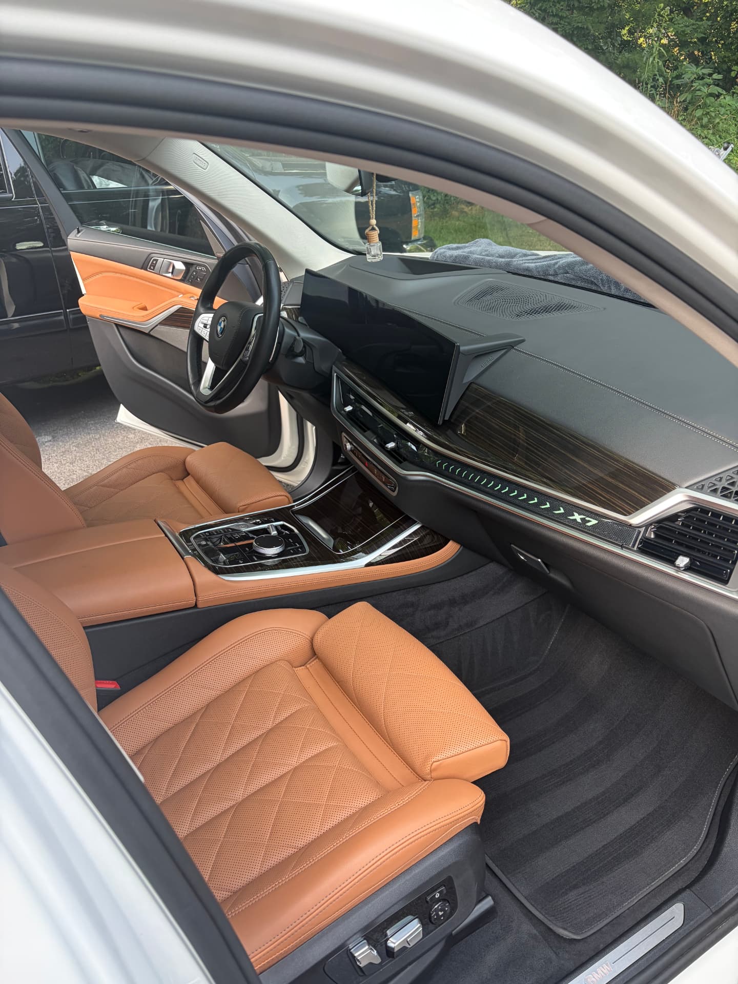 Deep cleaned tan leather interior of a BMW X7